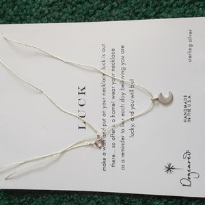 Crescent moon necklace on a string